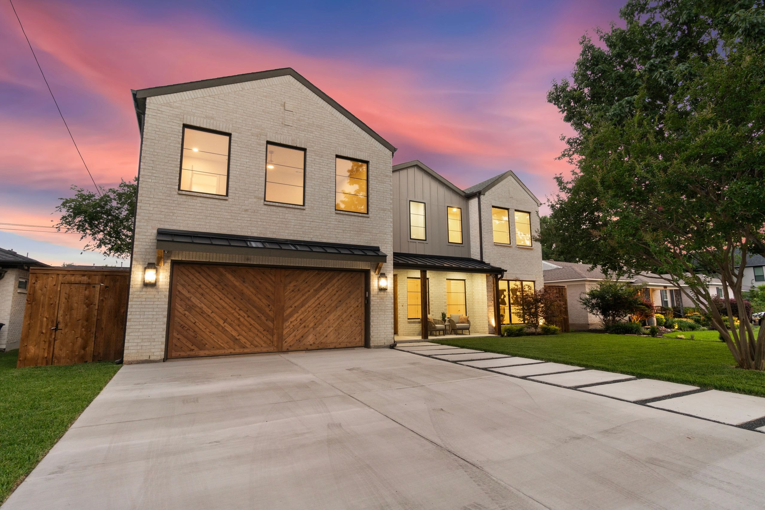 Modern two-story custom home at twilight